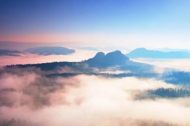 Photo of Beginning of spring. Fantastic dreamy sunrise above deep valley