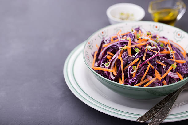 istock Red cabbage, carrot, onion and radishes sprouts salad 519747130