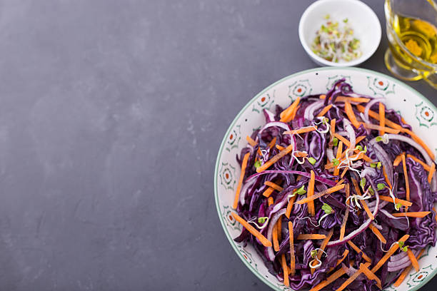 istock Red cabbage, carrot, onion and radishes sprouts salad 519747304