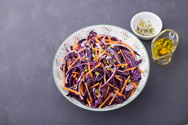 istock Red cabbage, carrot, onion and radishes sprouts salad 519747396