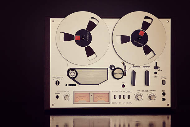 istock Analog Stereo Open Reel Tape Deck Recorder Vintage Closeup 519747695