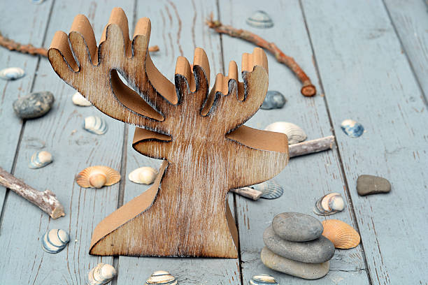 istock reindeer christmas decoration with shells and zen stones 519748029