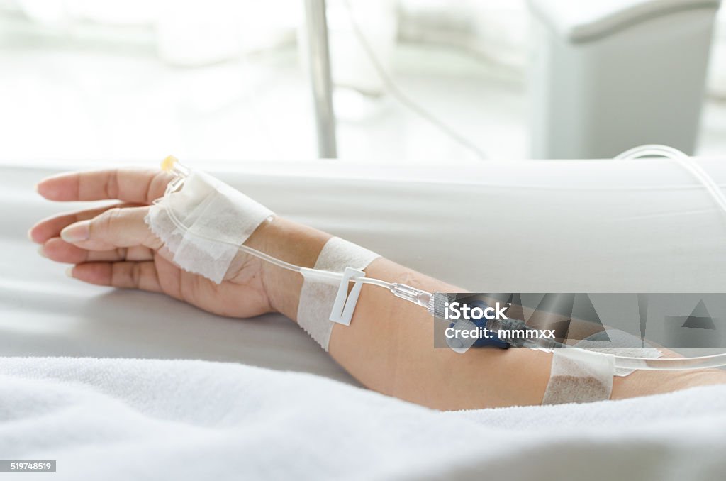 close up patients hand with saline solution close up of saline solution with patients hand Accidents and Disasters Stock Photo