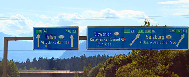 highway sign in austria near the Italian border great highway sign in austria near the Italian border villach stock pictures, royalty-free photos & images