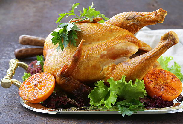 istock baked chicken with oranges and herbs for festive dinner 519750563