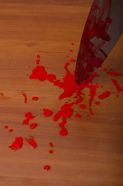 istock Hand holding a bloody knife 519750829