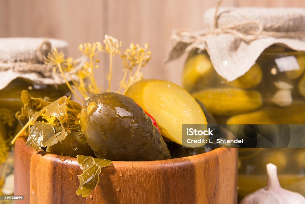 pickled gherkins in glass jars pickled gherkins in jars of home canning Bowl Stock Photo
