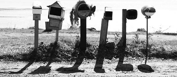 Black and white letterboxes stock photo