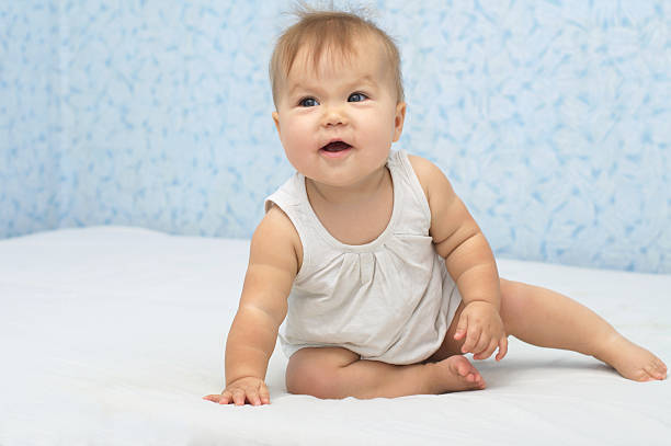 istock Happy baby smiling on bed 519752005