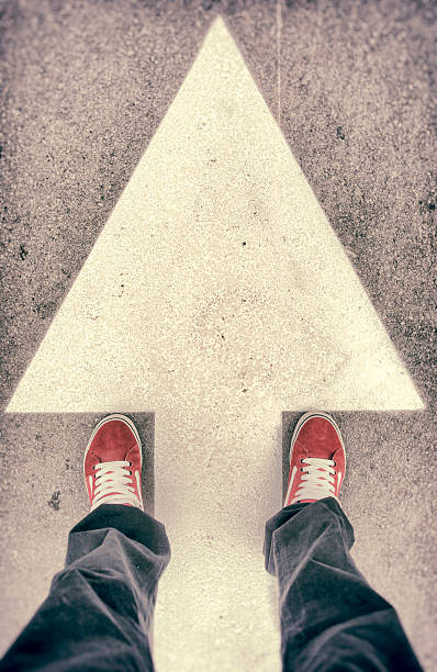 istock Shoes and forward arrow sign from above 519752147