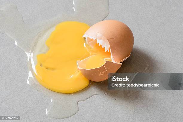 Egg Drop Crack Splattered Down On Ceramic Tile Stock Photo - Download Image Now - Agriculture, Animal, Animal Egg