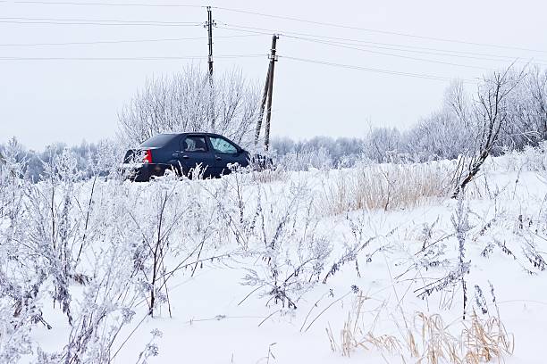 istock Black car on winter snowy road 519755030