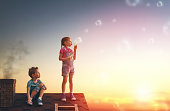 boy and girl playing on the roof