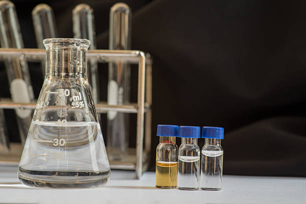 istock Blue cap vial in front of Laboratory glassware 519756760
