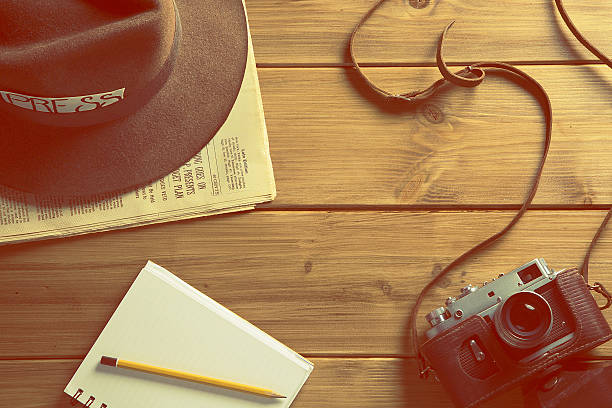istock vintage reporter hat fedora camera 519757472