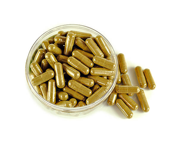 istock Herbal drugs capsules isolated on white. 519758270