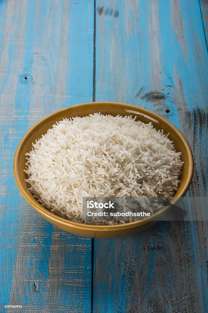 plain cooked white basmati or basamati rice in ceramic bowl indian basmati rice, pakistani basmati rice, asian basmati rice, cooked basmati rice, cooked white rice, cooked plain rice in ceramic bowl over colourful background Arts Culture and Entertainment Stock Photo