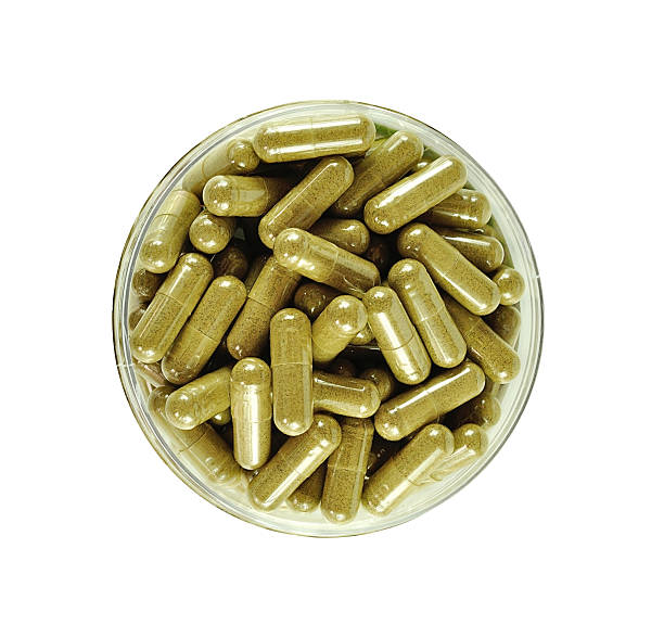istock Herbal drugs capsules isolated on white. 519761024