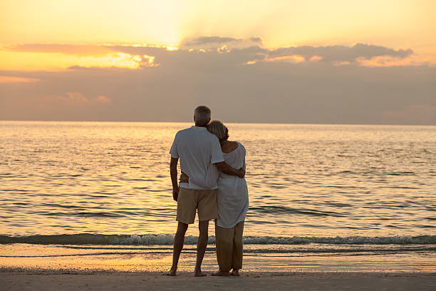 istock Senior Old Couple Sunrise Sunset Tropical Beach 519763775