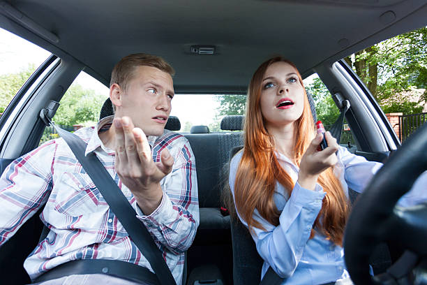 istock Frivolous woman making up in car 519764187