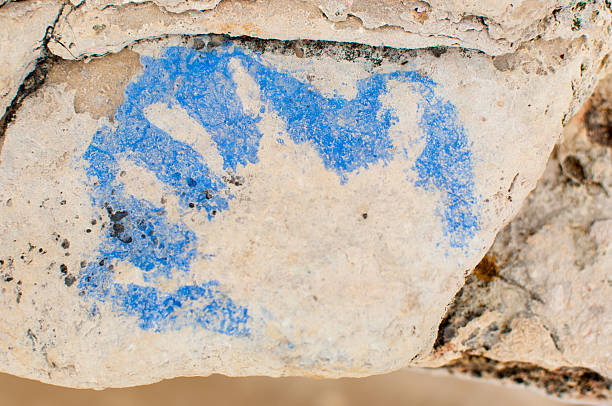 istock Hand painting on a rock by the seaside 519764835