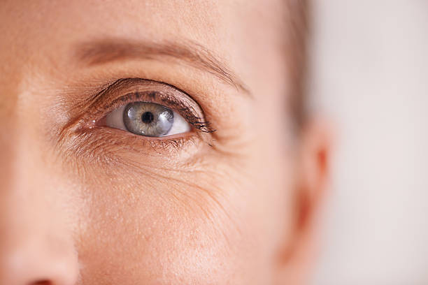 The fight against wrinkles Closeup studio shot of a beautiful mature woman's face cornea stock pictures, royalty-free photos & images