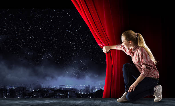 istock Girl opening curtain 519765219