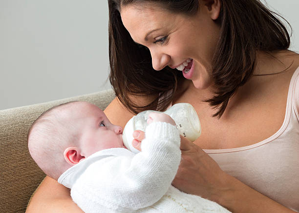 istock Mother Feeding Her Baby Boy 519766417