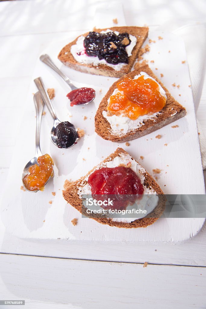 Breakfast bread and jam Italian breakfast made with whole wheat bread, butter and jam Bread Stock Photo