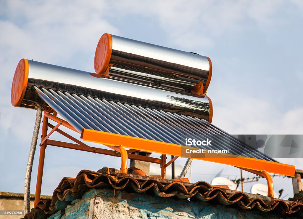 Sun Water heating system Sun Water heating system top of house Solar Energy Stock Photo