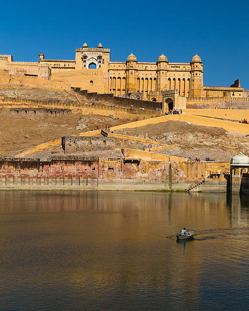 Amber Fort in Jaipur, India Jaipur, India - March 22, 2016: The outside of the Amber Fort in Jaipur, Rajasthan, India. Elephants and people can be seen. raja stock pictures, royalty-free photos & images