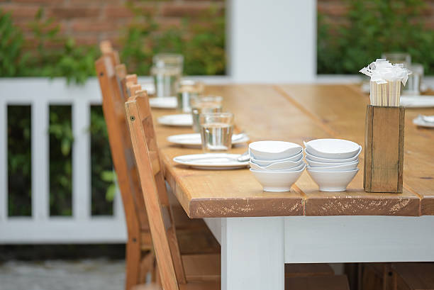 istock Dining table arrangement in a garden patio 519789392