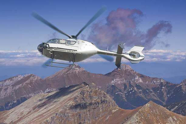 istock Helicopter in flight over a panoramic view of Tatra mountains 519789490