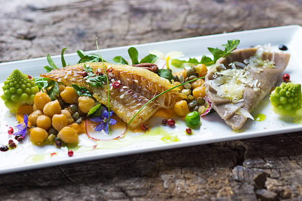 istock Fish fillet with chickpeas, carrot puree and vegetables 519791956