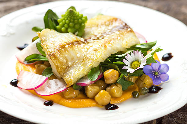 istock Fish fillet with chickpeas, carrot puree and vegetables 519792212