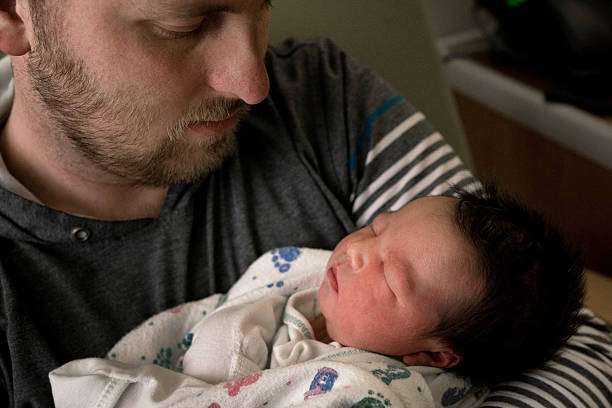 istock Young Father and Newborn Daughter Together 519792318