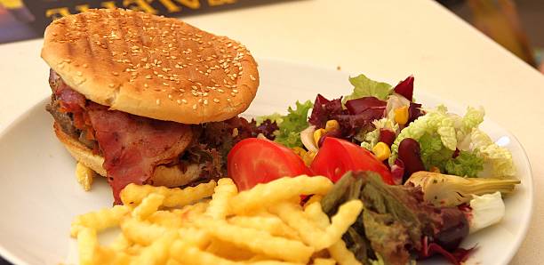 istock Cheeseburger with meat, bacon and salad 519792590