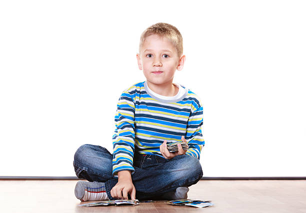 istock Little boys have fun and play cards. 519792740