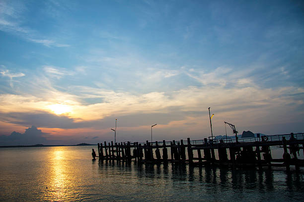 istock Sunset at the beach and bridge a beautiful 519801929
