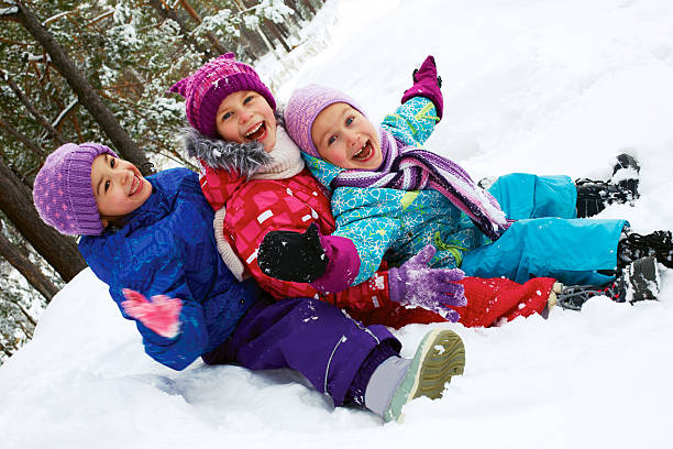 istock Winter fun, snow, happy children sledding at winter time 519804305