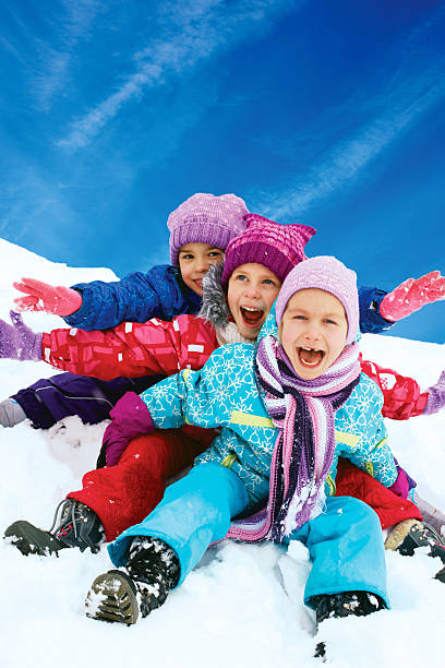 istock Winter fun, snow, happy children sledding at winter time 519804311