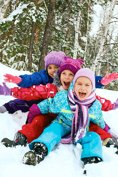 istock Winter fun, snow, happy children sledding at winter time 519804313