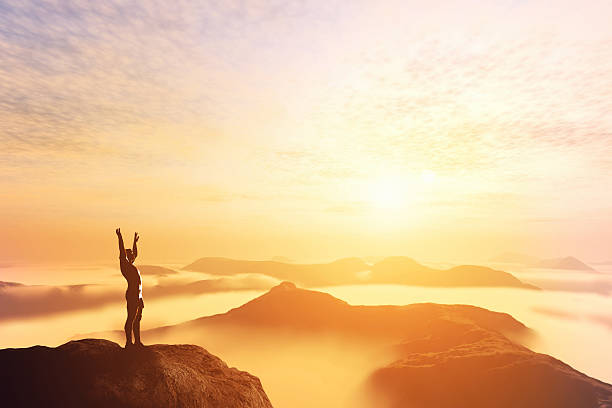 istock Man with hands up on the top of a mountain 519804385