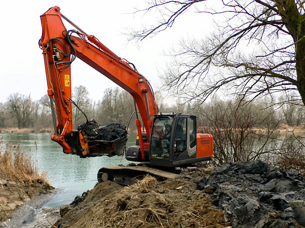 istock excavator digs inflow into lake for a fish pass 519806517