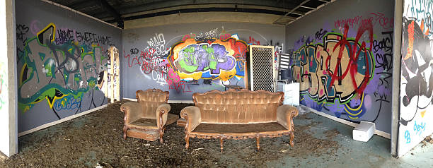 istock Abandoned urban building with graffiti and willful damage. Panor 519806843