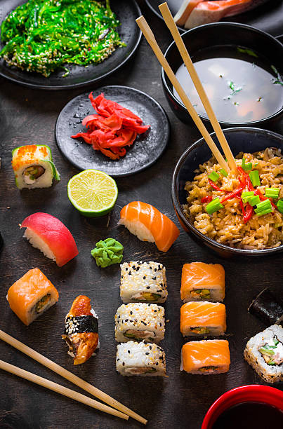 istock Table served with sushi and traditional japanese food 519821910