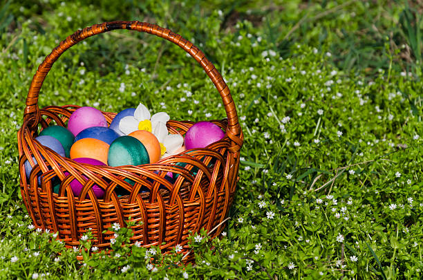 istock Easter eggs in green grass. Festive decoration. 519823302