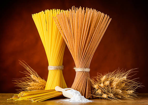 istock Brown and Yellow Spaghetti with Wheat and Flour 519823622