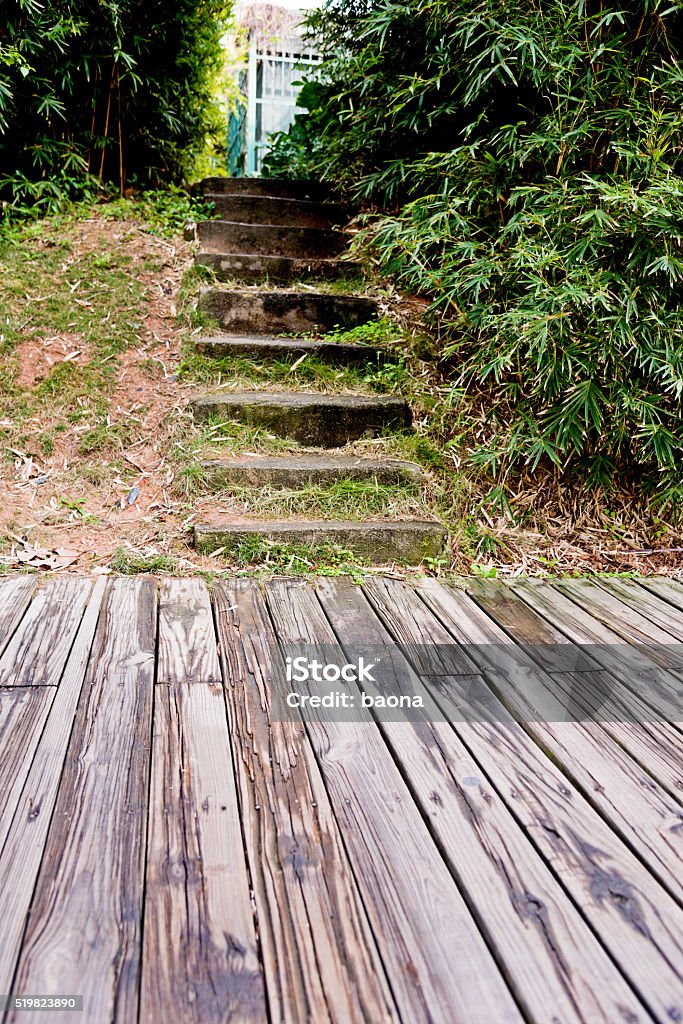 Garden with stairs and wood floor Garden with stairs and wood floor  in China. Bush Stock Photo