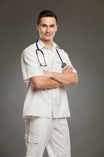 istock Smiling doctor with arms crossed 519824739